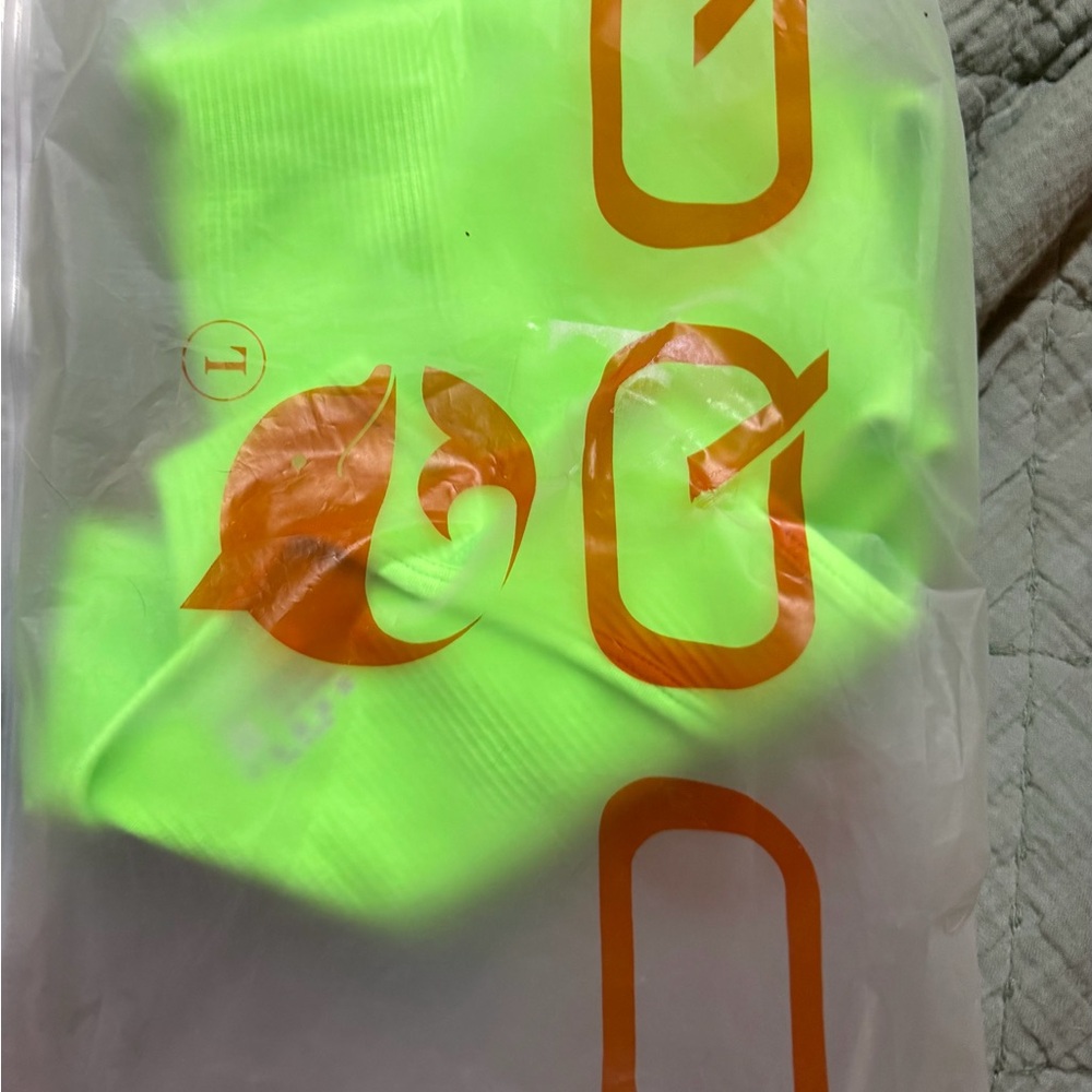 Neon Green OQQ brand new body suit size large.